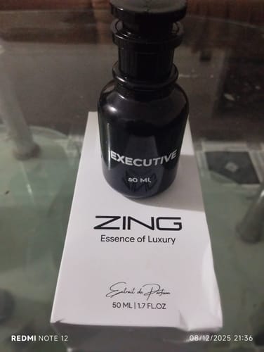 Customer's sleek black bottle of Executive fragrance displayed on top of its white product box.