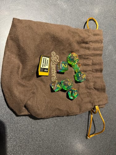 Customer photo review of Premium Mystery Dice Set – 100's of different dice, stickers and pins! Handpacked in Portland, OR.