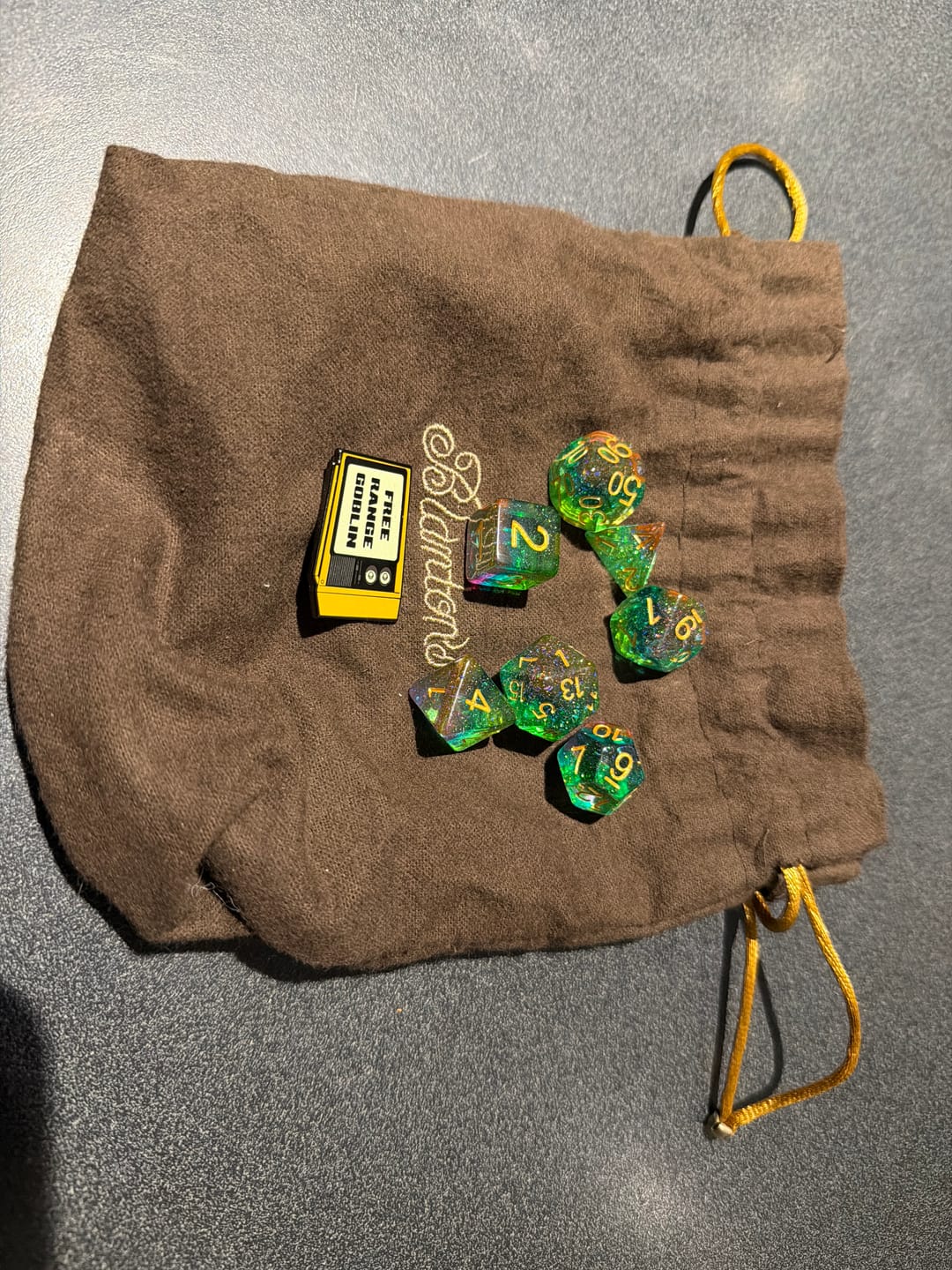 Customer photo review of Premium Mystery Dice Set – 100's of different dice, stickers and pins! Handpacked in Portland, OR.