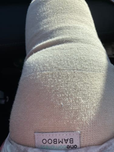 Customer wearing the Premium Bamboo Knee Sleeve in a close-up view showing the soft, textured fabric.