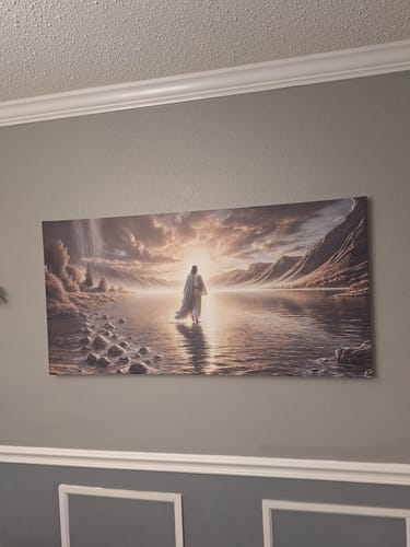 Customer's 'Walking on Water' faith wall art hanging on a light gray wall above white wainscoting.