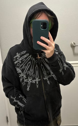 Customer photo review of 10 Billion Swords Hoodie