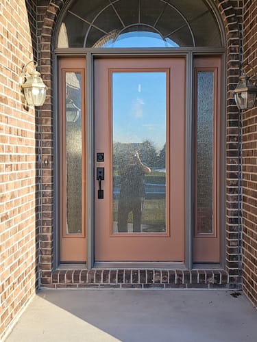 Reviewer's installed Rain Glass and Frame Kit on a tan front door with matching sidelights.