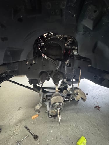 Customer's new Upper Control Arm installed on the suspension of a Ford F150.