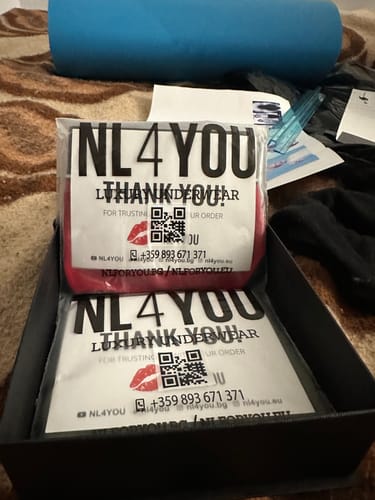 Reviewer's Red & Black Christmas Underwear in its original branded packaging inside a box.