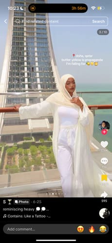 Reviewer wearing the full Faux Fur Plush Long Coat on an outdoor balcony.