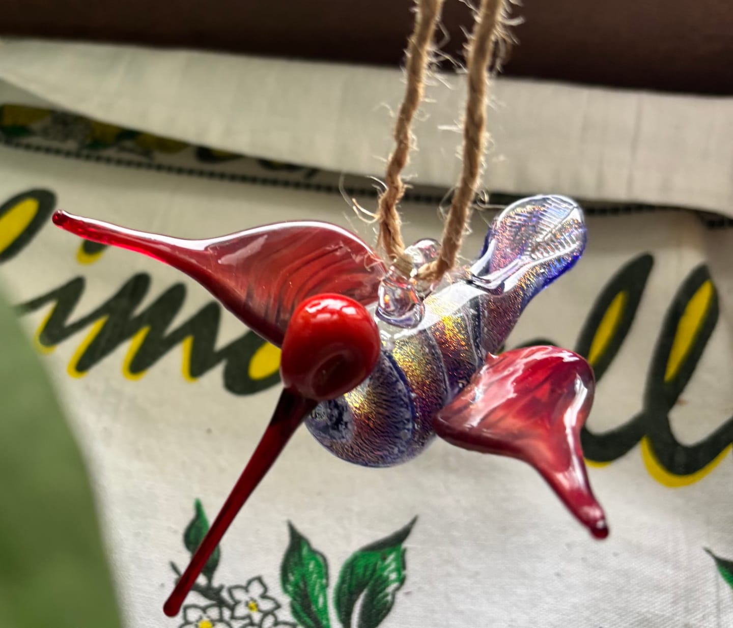 Customer photo review of Red Dichroic Twist Glass Hummingbird with Infused Ash