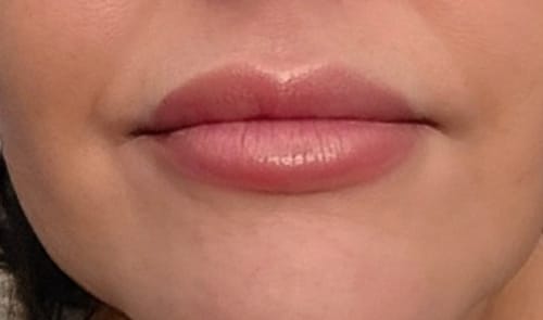 Customer shows a close-up of their smooth, hydrated lips wearing La La Lips Lip Balm.
