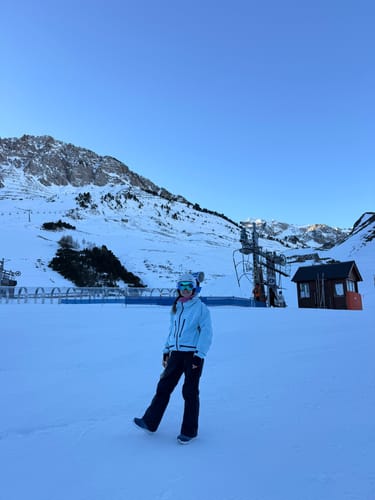 Reviewer wearing the insulated snow jacket while standing on a snowy mountain.