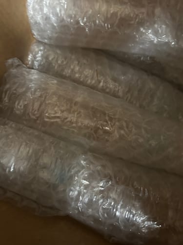 Customer's photo showing items well-protected with bubble wrap inside a shipping box.
