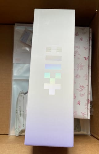 Box containing the reviewer's ILLIT LIGHTSTICK, showing the iridescent logo on the white packaging.