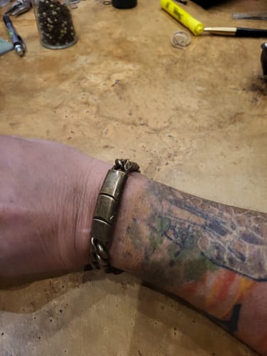 Customer wearing the antique-finish Viking Courage Cuban Link Bracelet on their wrist.
