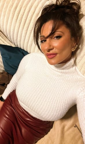 Reviewer shows off their smooth, glowing skin after using the Glow Infusion Duo.