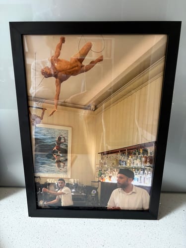 Customer's photo of a Sicilian cafe in a black Your Memory Framed LS Art Print.