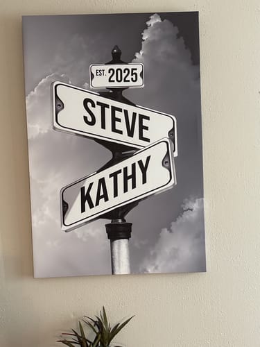 Customer's black-and-white 'COUPLES DATE OF LOVE' canvas showing street signs with the names 'Steve', 'Kathy', and the date 'EST. 2025'.