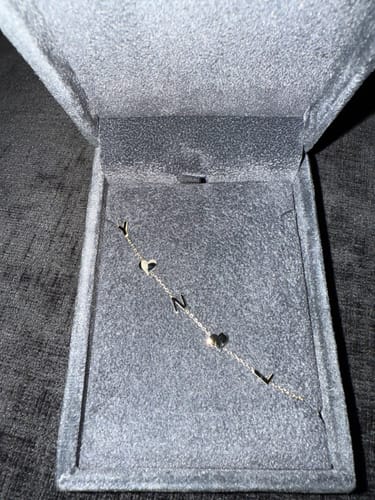 Customer photo review of 14K Solid Gold Sideways Paw Initial Necklace