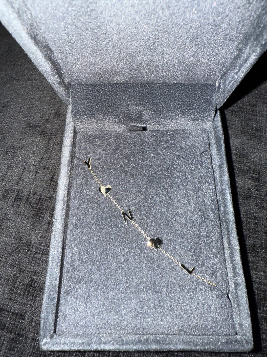 Customer photo review of 14K Solid Gold Sideways Paw Initial Necklace