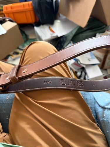 Customer's close-up of the brown Montana Bison belt, showing the interior with the Hanks logo and rugged double stitching.