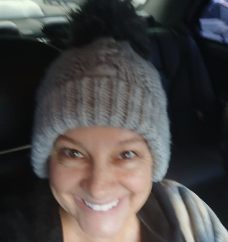 Reviewer's smiling selfie, associated with a review for Neptune Tallow & Manuka Honey Lip Balm.