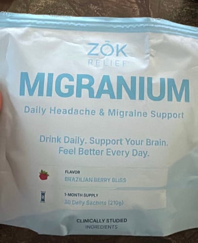 Reviewer's pouch of Migranium daily headache support in the Brazilian Berry Bliss flavor.