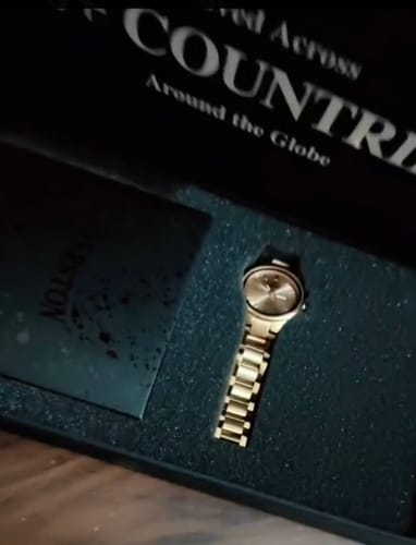 Customer's new Aristos watch displayed inside its black presentation box.