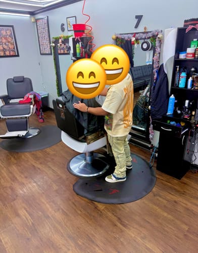 Reviewer standing in a barbershop wearing the light blue wash Rawstate Stacked Denim.