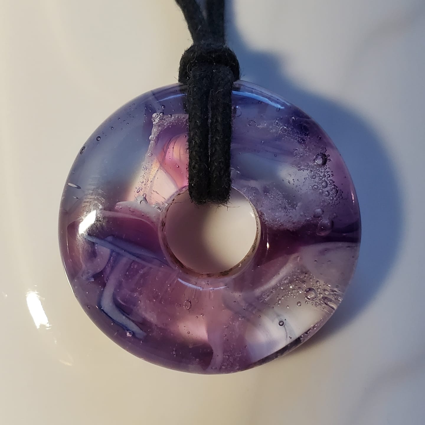Customer photo review of Taffy Confetti Halo Pendant with Infused Cremation Ashes