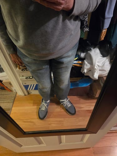 Reviewer in a mirror selfie showing the fit of the Summer Love Judy Blue cropped jeans with a grey sweatshirt and sneakers.