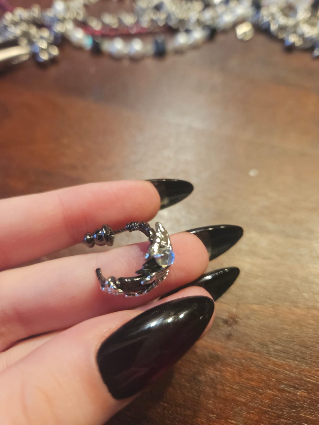 Customer photo review of "Lucifer" 18K Gold Plated Gothic Black Swan Feather Dangle Earrings, Statement Studs