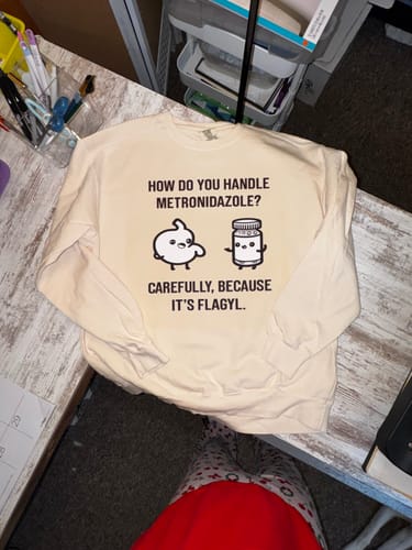 Customer's cream-colored sweatshirt with a sharp, custom print created using the White DTF ink.