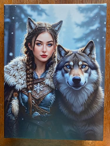 Customer's 'The Winter Huntress' personalized portrait on canvas, showing a young woman and wolf in a snowy forest.