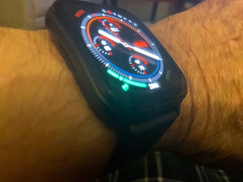 Close-up: Reviewer's Gard Pro Health Smartwatch 3 on their wrist with its illuminated and colorful display active.