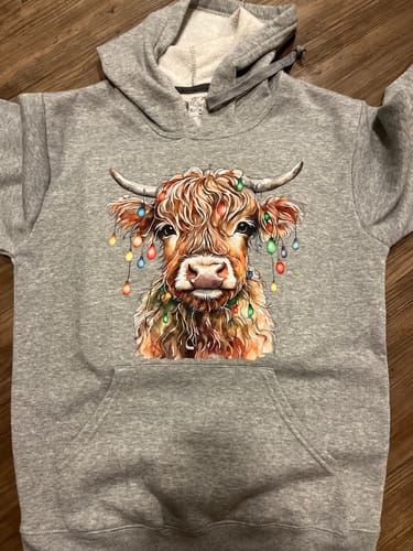 Customer photo review of Christmas Highland Cow | DTF Transfer