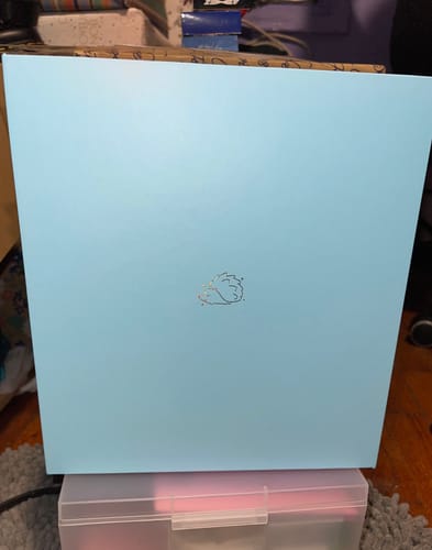 Reviewer's light blue ODI BINDER shown closed, highlighting the small logo on the front cover.