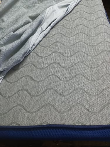 Customer's close-up of the Flo Mattress Ergo, showing the gray top with its wavy pattern.