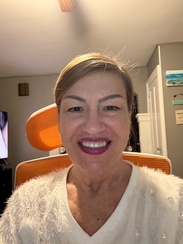 Reviewer's face after using the Glov Micro Infusion System, showing a radiant and smooth complexion.