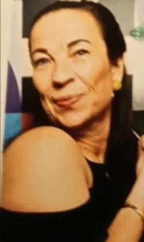 A smiling reviewer showing their clear, smooth skin after using the 5-Step Clear Skin Kit.