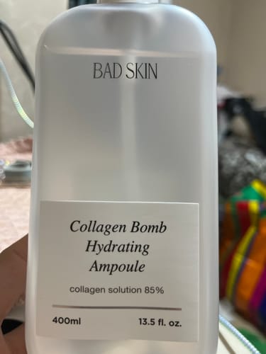 Customer's close-up photo of the Bad Skin Collagen Bomb Hydrating Ampoule in its 400ml translucent bottle.
