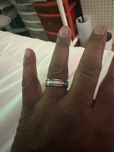Customer showing the Kaelen ring with sparkling zircon inlays on their hand.