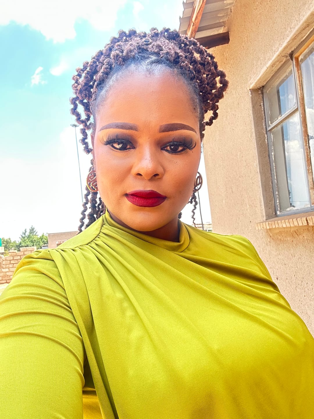 Customer photo review of Gold Luxe Mini Logo Hoops