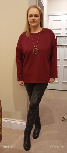 Reviewer providing a full view of the comfortable Laure Wine Longline Necklace Top.