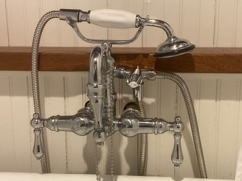 Reviewer's vintage-style chrome tub fixture using the 3-Way Shower Arm Diverter to add a handheld shower head.
