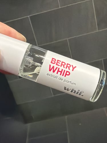 Customer holding a small bottle of Berry Whip perfume from the Discovery Set.