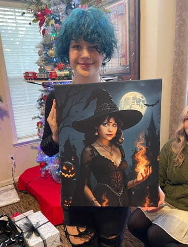 Customer smiling while holding their personalized 'The Midnight Sorceress' canvas print.
