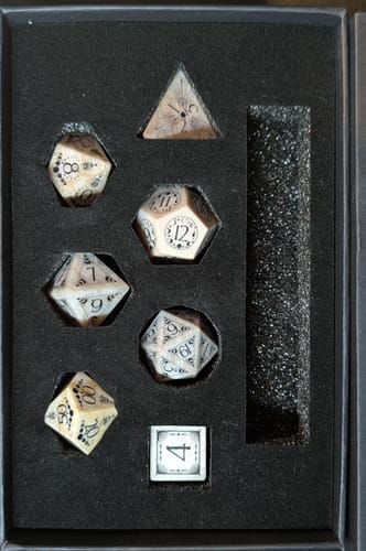 Reviewer's URWizards Coral Fossil Engraved Dice Set arranged in its protective black foam case.