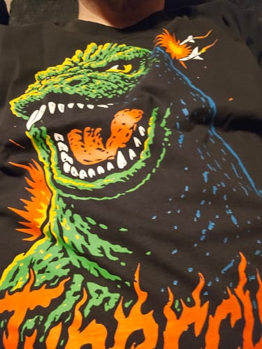 Customer's close-up of the ANGRY ZILLA OVERSIZED BOX TEE, showing the vibrant green and orange Godzilla graphic.