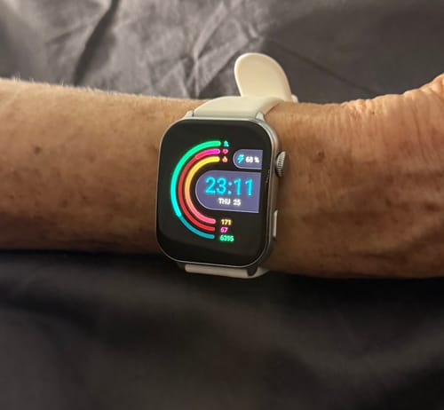 Customer wearing the Gard Pro Health Smartwatch 3 with a white band, showing the bright, colorful display on their wrist.