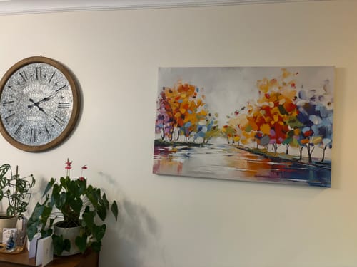 Customer's 'Vibrant Reflections' canvas hanging on a hallway wall, adding a vibrant pop of color to the space.