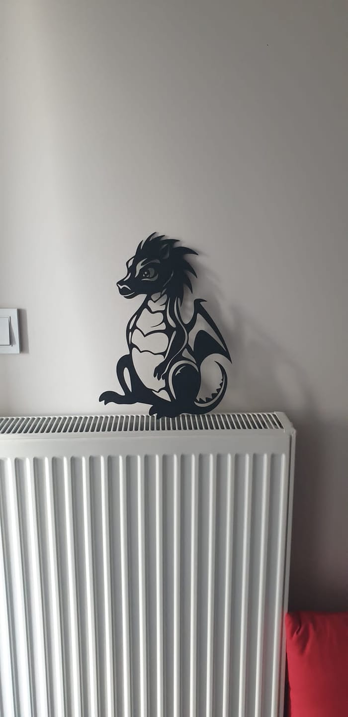 Customer photo review of Minik Ejderha Metal Duvar Dekoru
