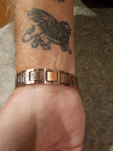 Customer wearing the Templar Cross Copper Magnetic Bracelet on their wrist, showing its detailed linked design.